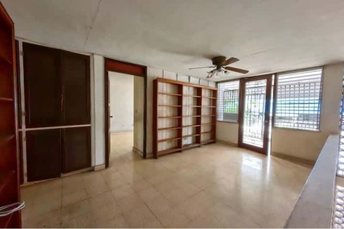 Spacious kitchen with window, storage and tiled backsplash Panama city