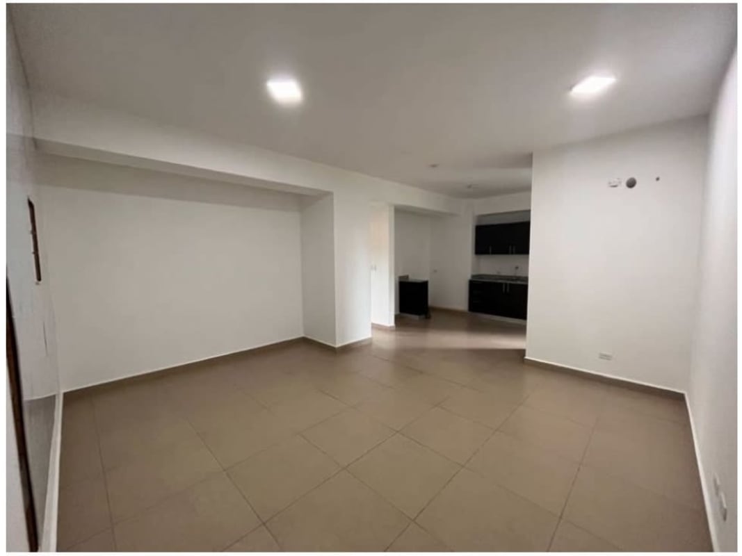 Bright living room with ceramic tile floors and open kitchen layout in PH Ceceda Panama