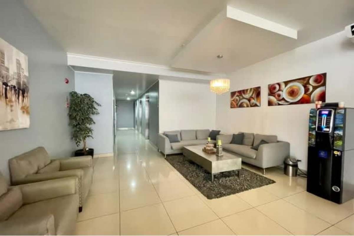Spacious modern lobby with sectional sofas, chandelier and visitor area PH Parque Lefevre Panama City