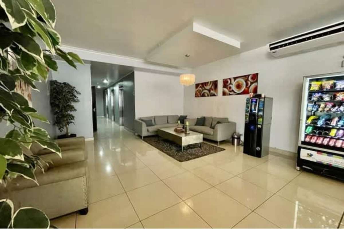 Lobby lounge with snack vending machine and sofa in PH Parque Lefevre Panama City