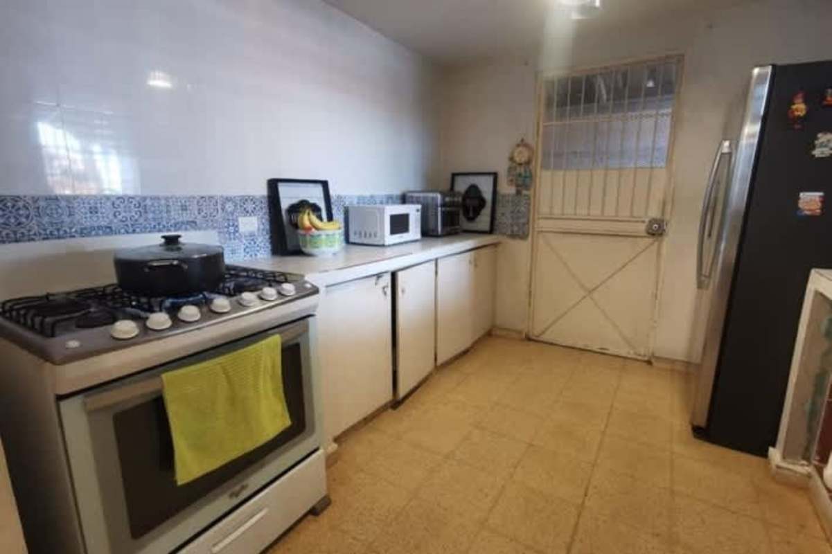 Dining room with sliding glass doors and bright space in La Fontana Chanis Panama