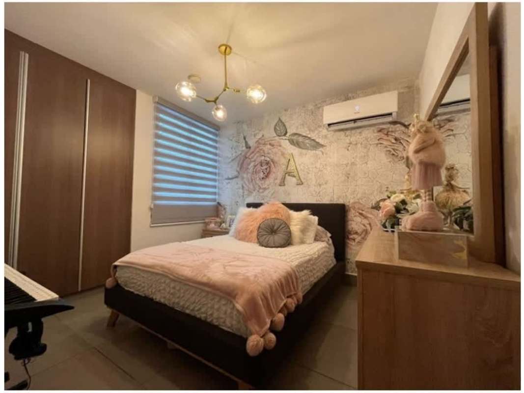 Contemporary kitchen with granite countertops, wood cabinets, appliances in PH Parque del Carmen Bella Vista Panama