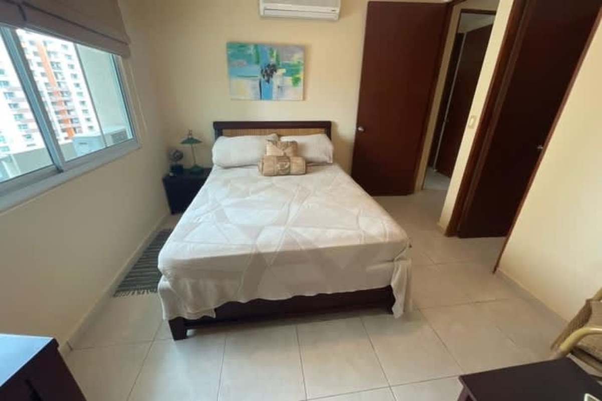 Bright secondary bedroom with city views and built-in closets in PH Costa Pacifica Panama