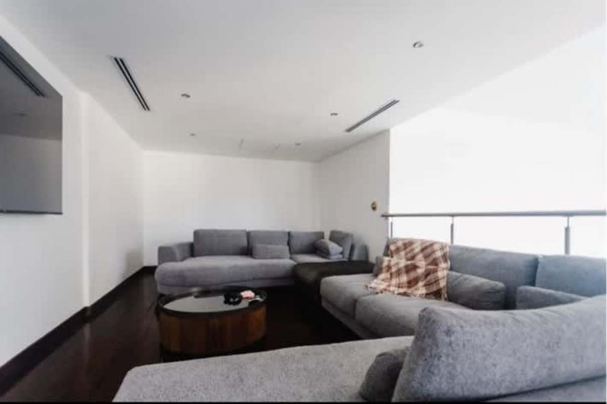 Luxury kitchen with island, marble counters, designer lighting in Yoo Panama