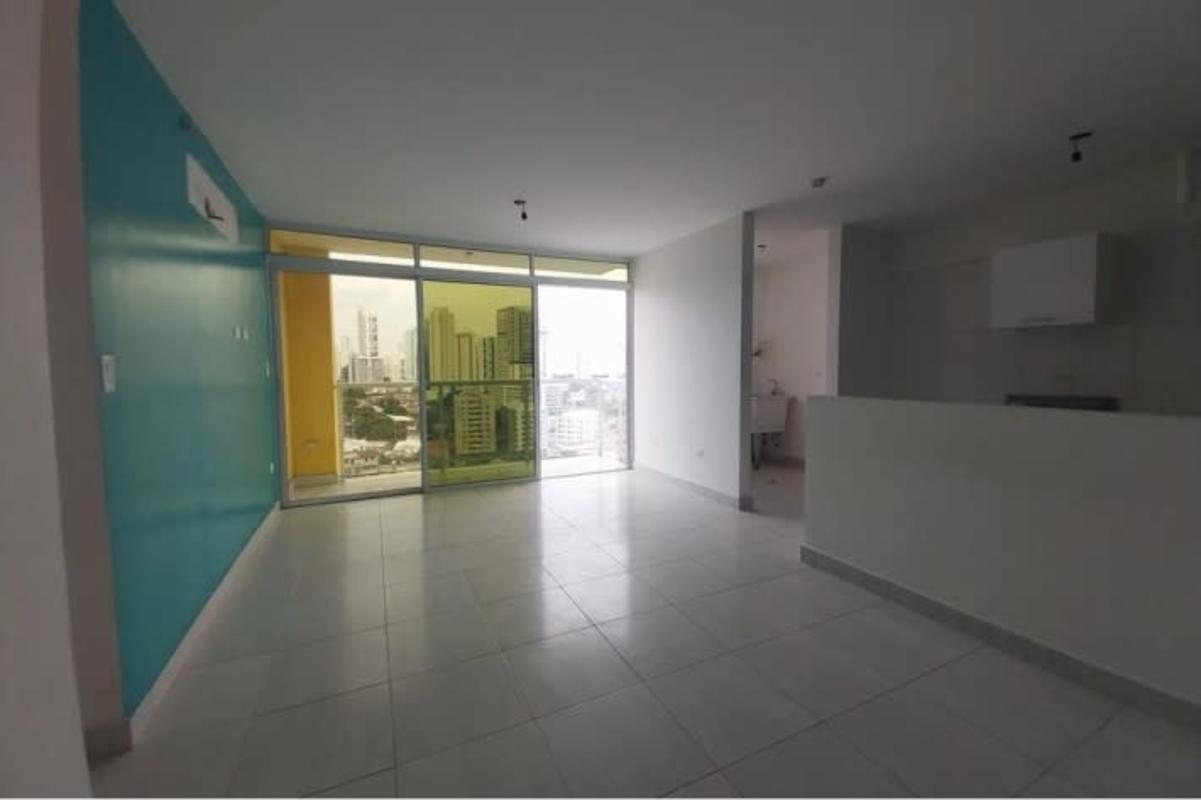 Living and dining area with city views from balcony in PH Metropolitan Carrasquilla Panama City