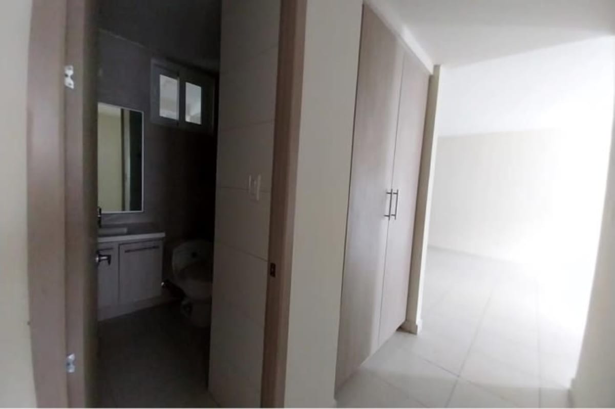 Spacious living dining area with sliding doors to balcony in Panama apartment for sale