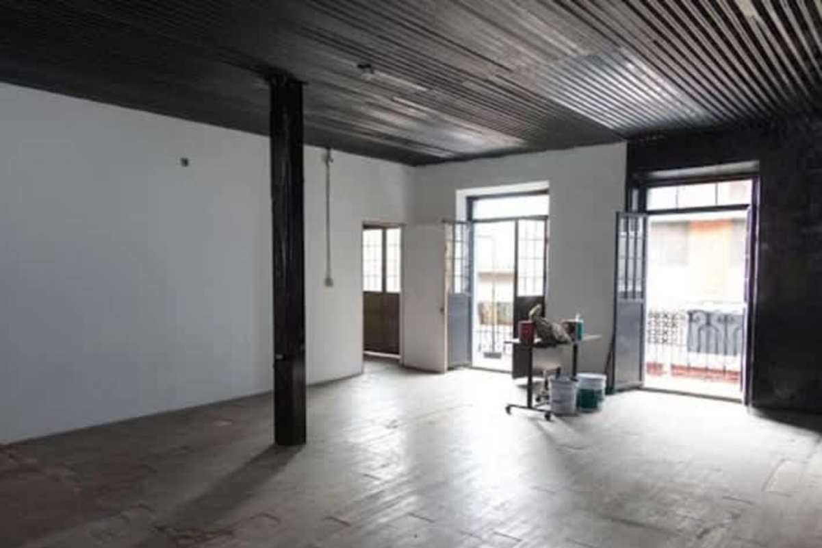 Large industrial loft interior with black corrugated ceiling Casco Viejo Panama