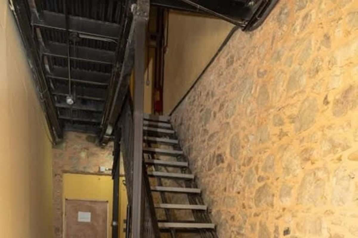 Exposed brick and stone walls in interior stairwell colonial building Casco Viejo Panama