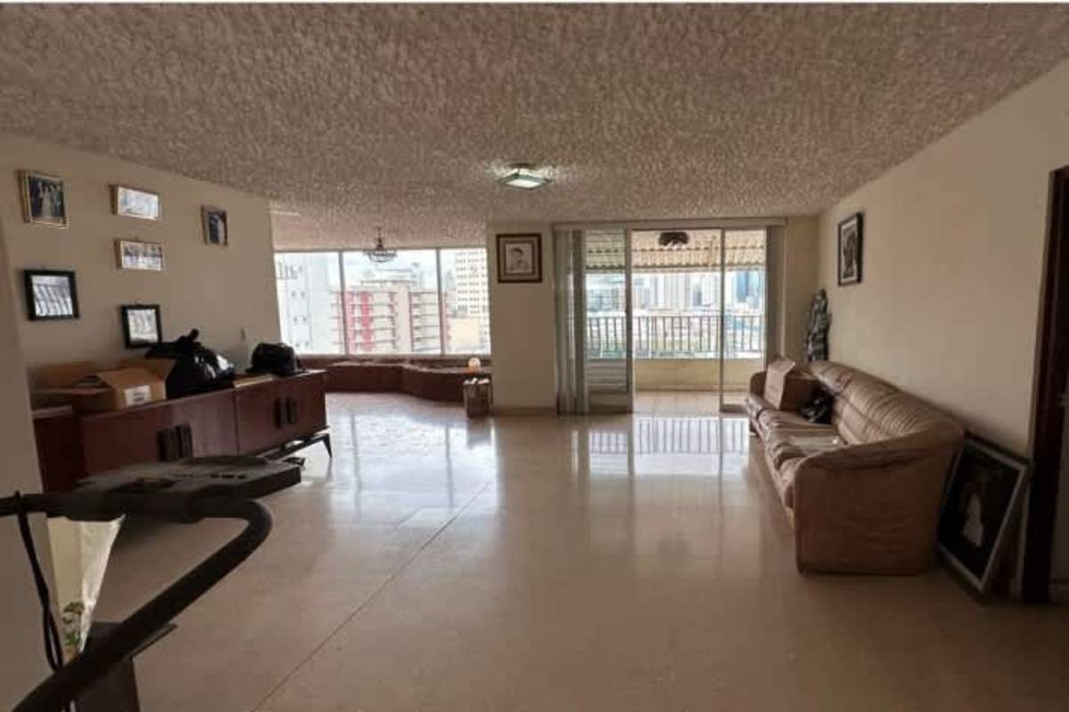 Open living area with large windows and city view in PH Mont Royale penthouse for sale Panama