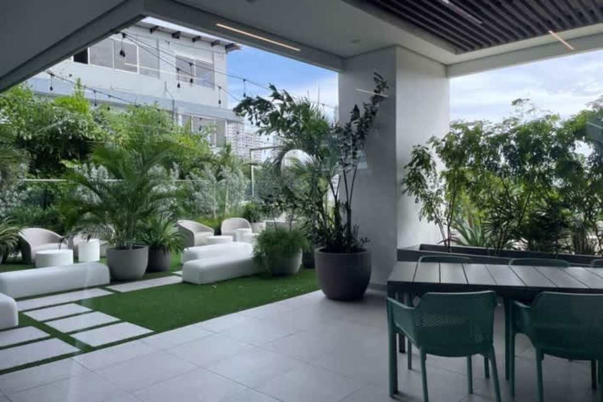 Open concept living room with modern decor and large windows PH El Cangrejo El Cangrejo Panama City