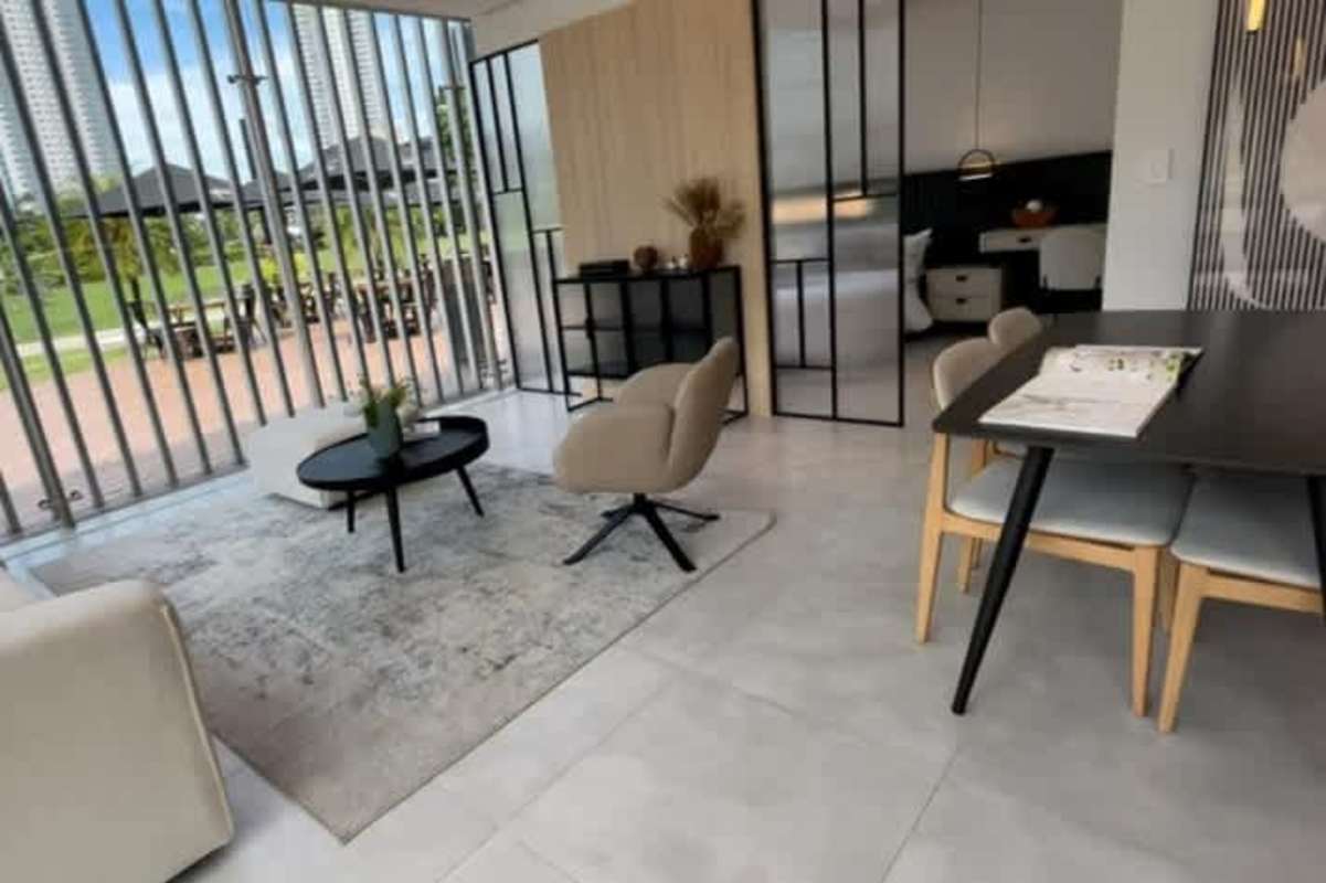 Bright open-plan living dining with large windows and minimalist furniture PH Arcadia Costa del Este Panama