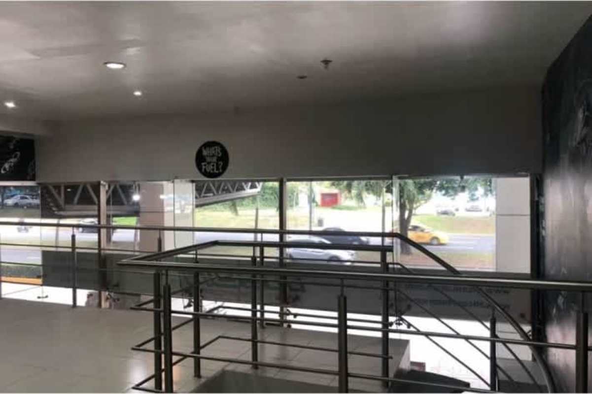 Commercial lobby space with glass walls and metal railings PH H2O Avenida Balboa Panama
