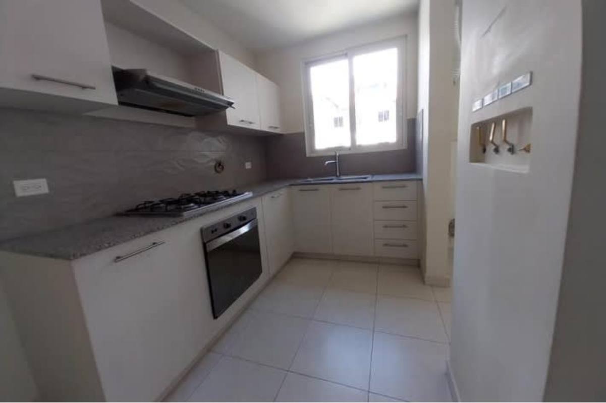 Large swimming pool with gardens at PH Versalles II Panama