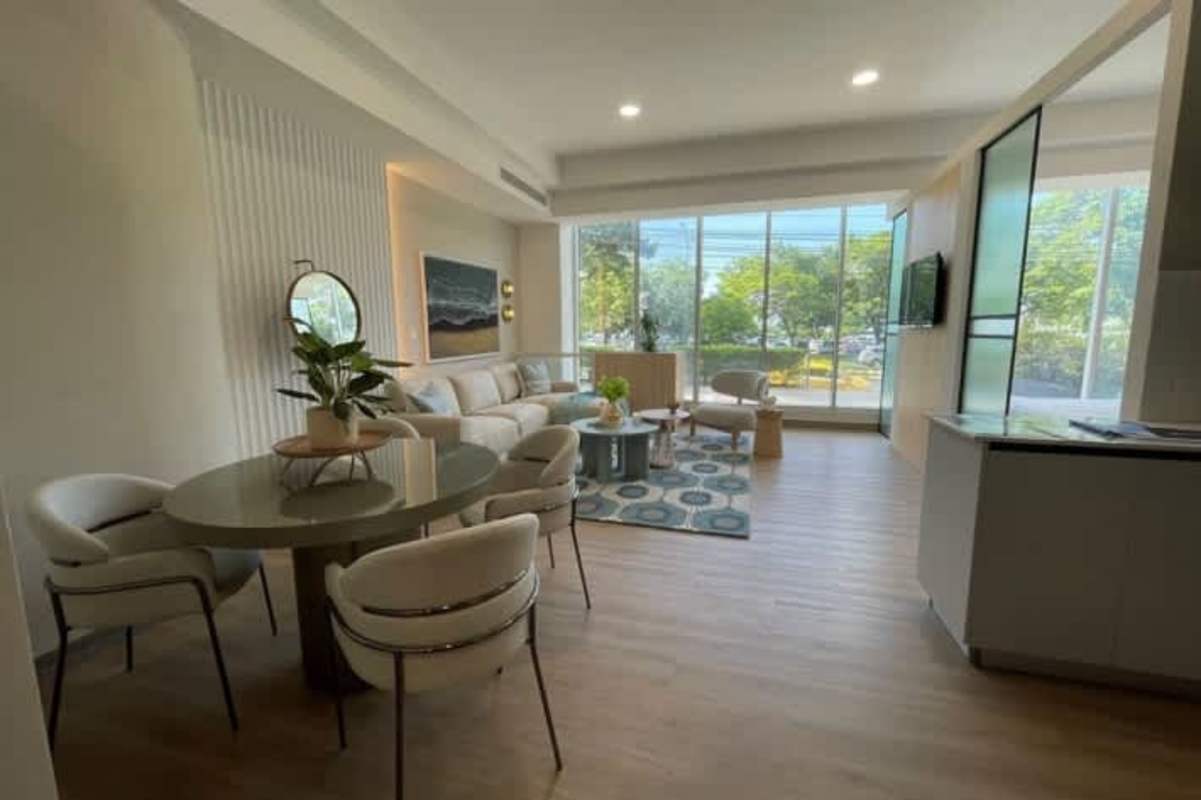 Modern compact kitchen with wood cabinetry quartz counters PH BICSA tower Panama City