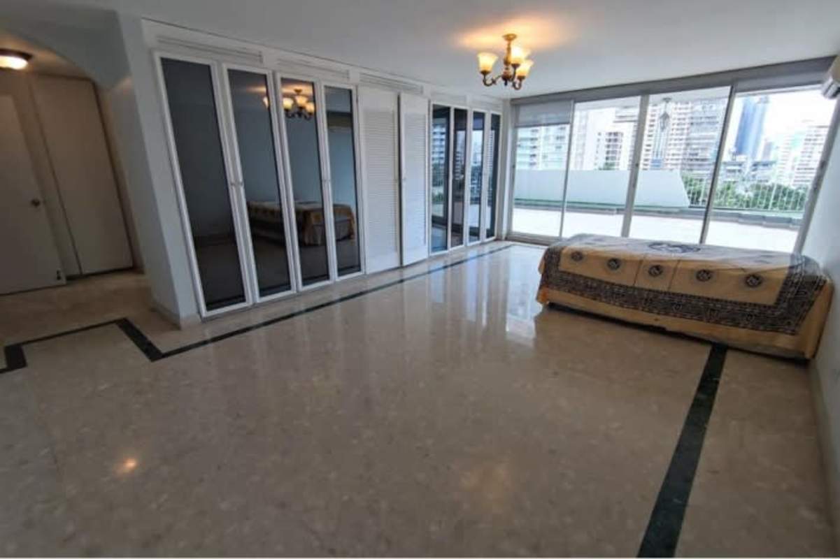 Spacious terrace with tile flooring, railing, and ocean-city panorama PH Paitilla Tower Punta Paitilla