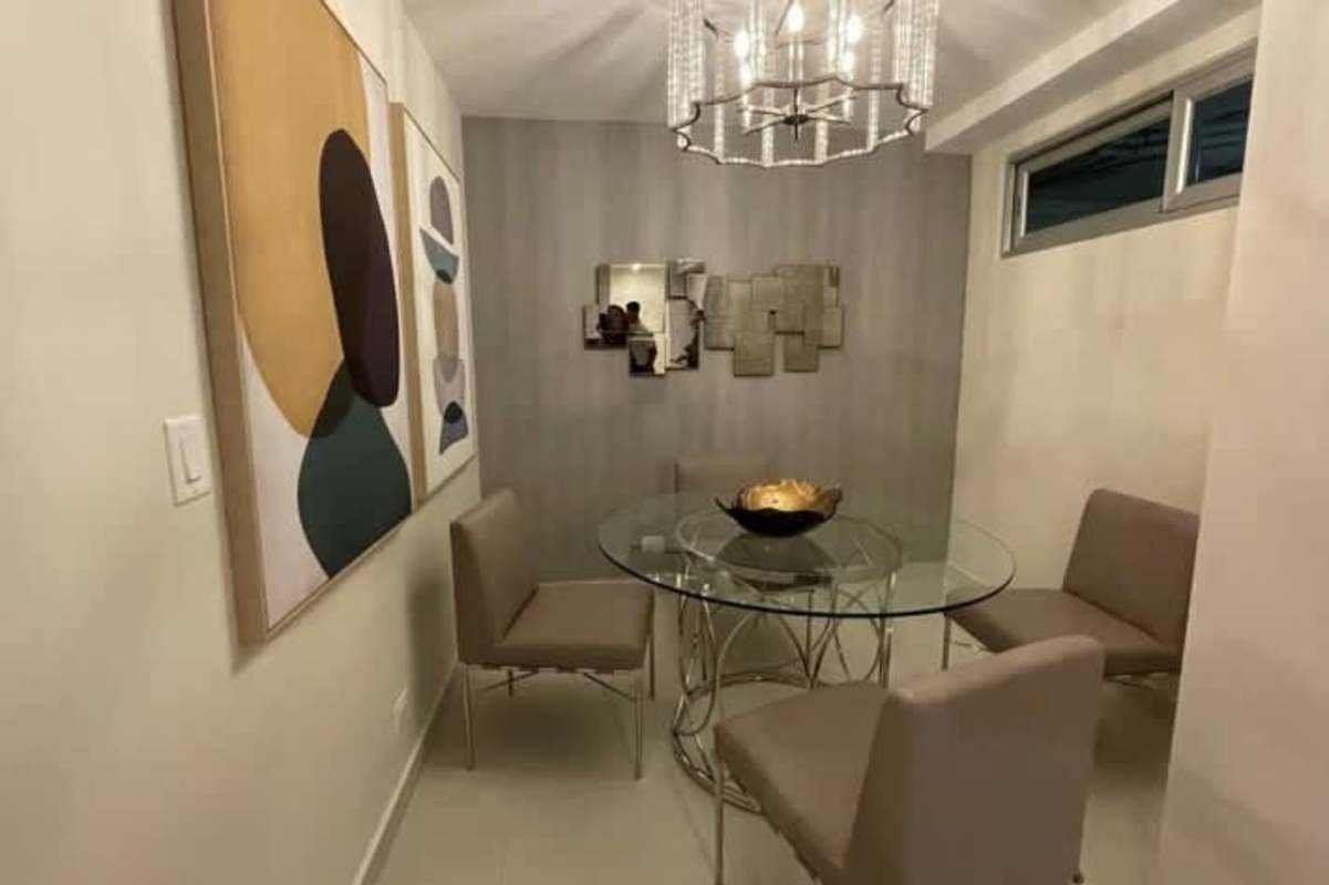 Contemporary dining room with glass top table, padded chairs, wall art in PH Via Brasil 57 Obarrio Panama