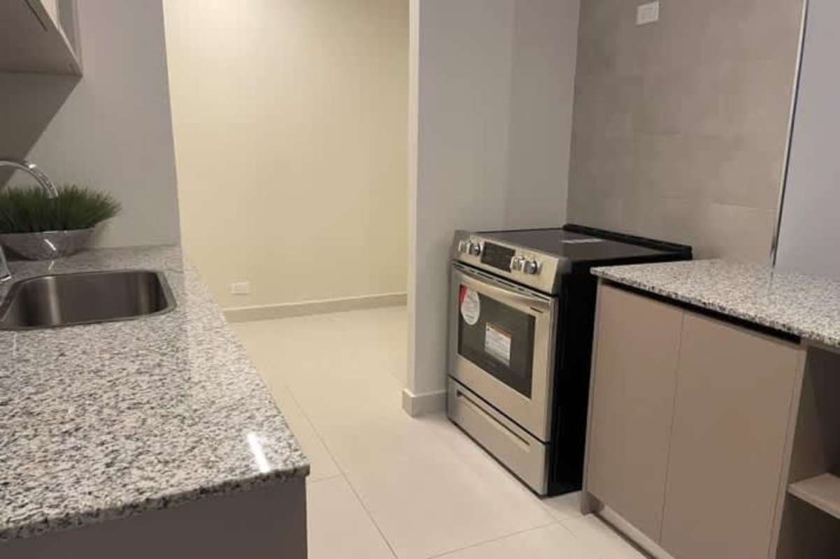 Modern kitchen with granite countertops, electric oven, sleek cabinets in PH Via Brasil 57 Obarrio Panama