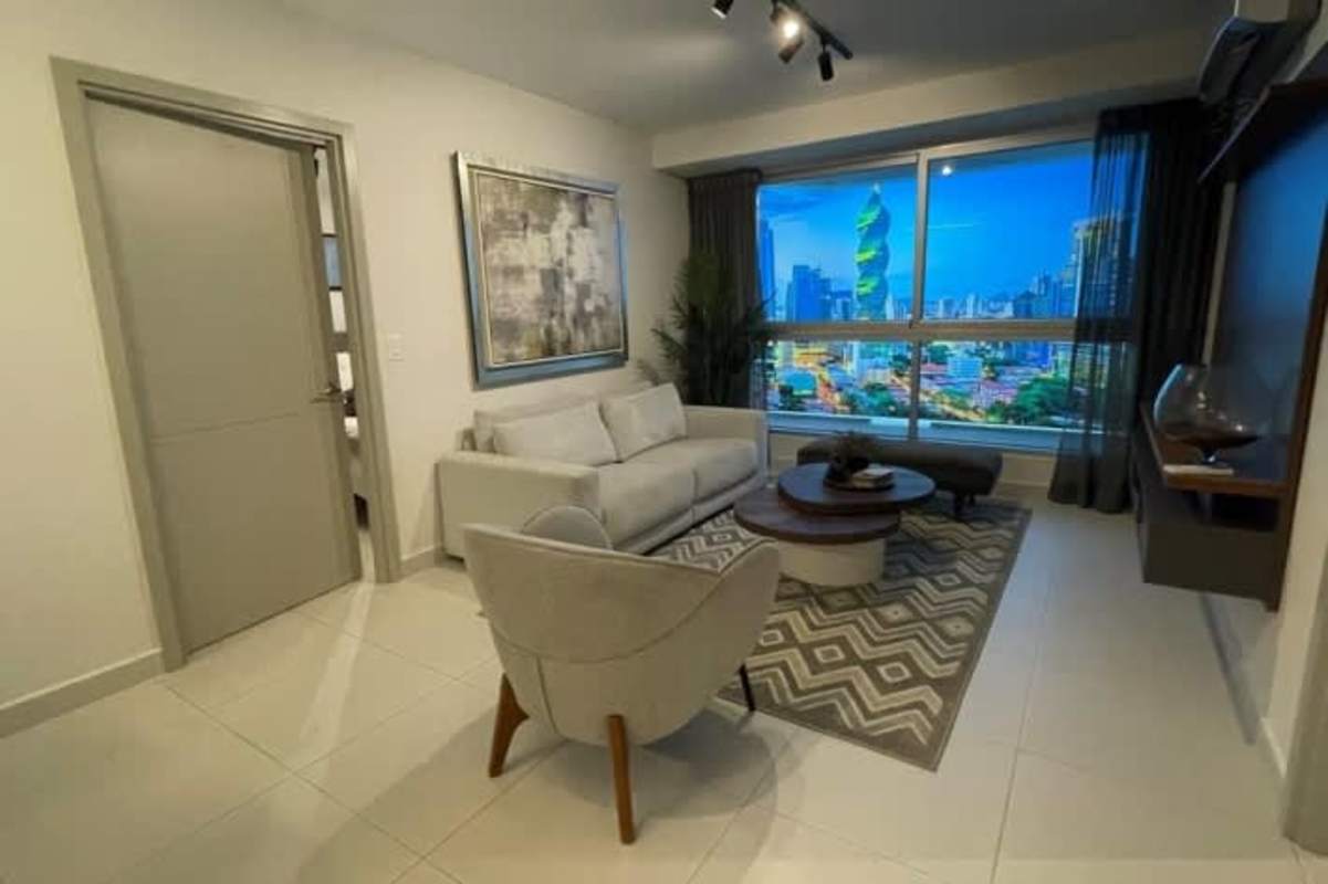 Bright living room with large windows and city skyline view PH Via Brasil 57 Obarrio Panama City