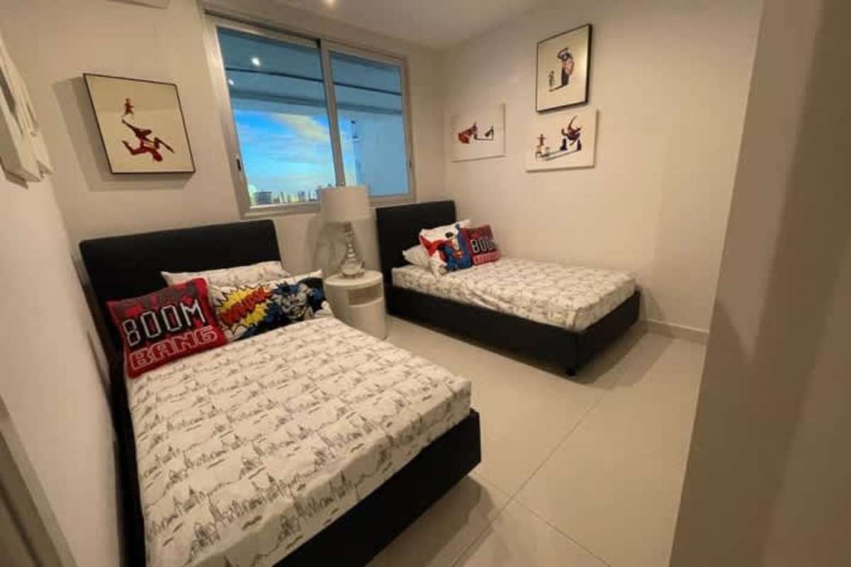 Children's bedroom featuring twin beds with superhero decor in PH Via Brasil 57 Obarrio Panama