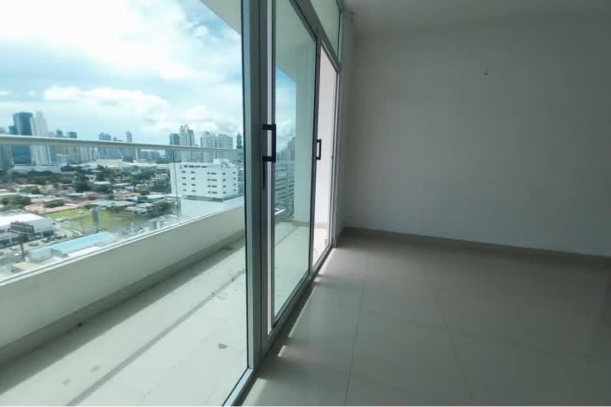 Modern bedroom with built-in closet, large window and city skyline view PH Firenze Tower San Francisco Panama