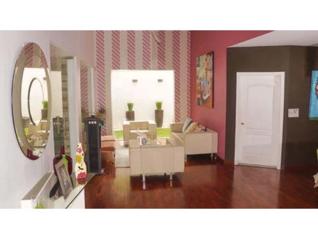 Contemporary dining room with designer chairs wooden table and pendant lighting Altos de Panamá house for sale