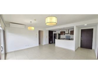 Open plan living and dining area with sliding glass doors Woodlands Panama Pacifico