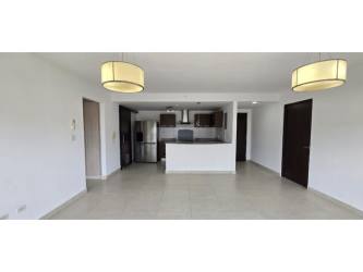 Modern kitchen with breakfast bar and appliances in PH Woodlands Panama Pacifico apartment