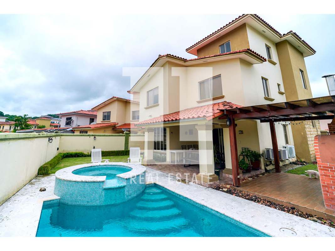 Backyard terrace with brick BBQ grill, wood-fired oven and covered dining area in PH Paseo Dorado