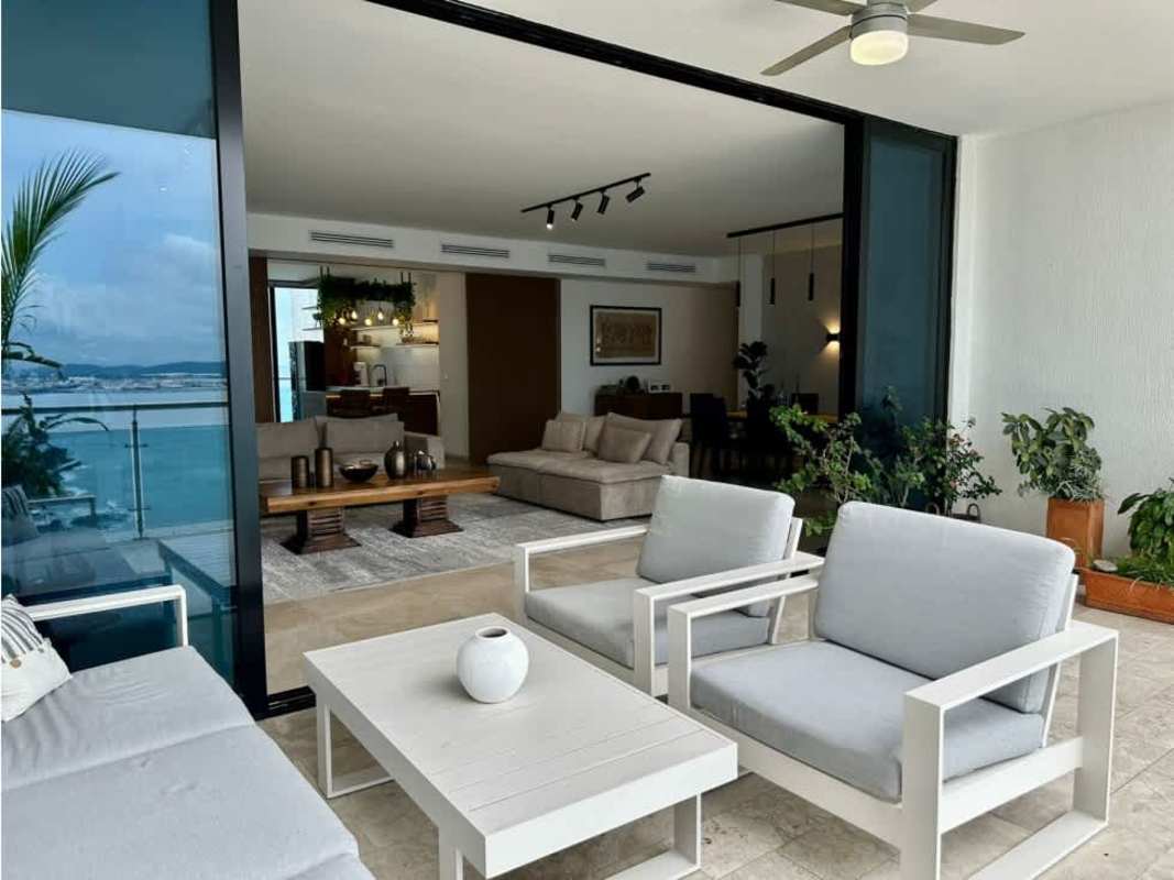 Modern dining space opening to terrace with panoramic Punta Pacifica skyline views in PH Aqualina Panama