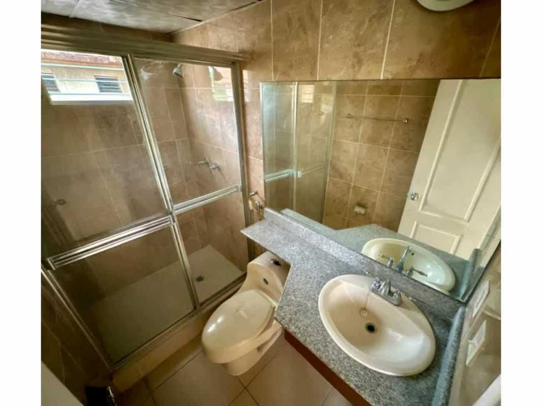 Bathroom interior with granite vanities and glass shower enclosure PH Mallorca Park Village Panama
