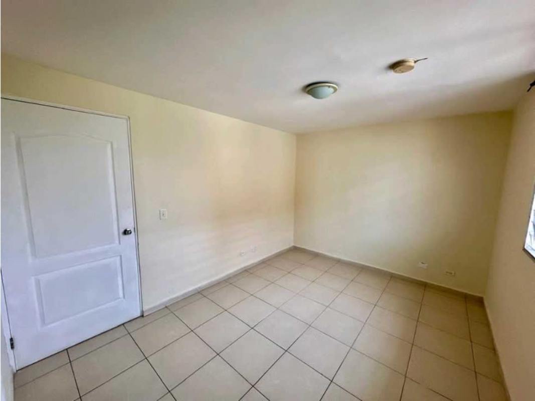 Second bedroom with ceramic tile and neutral walls in PH Mallorca Park Village Panama City