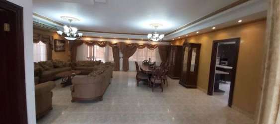 Modern bathroom granite counter glass-enclosed shower tiles family home Colon Panama