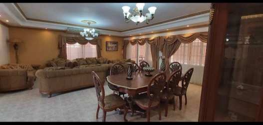 Open plan living dining with chandeliers and tile floor family house for sale Margarita Colón