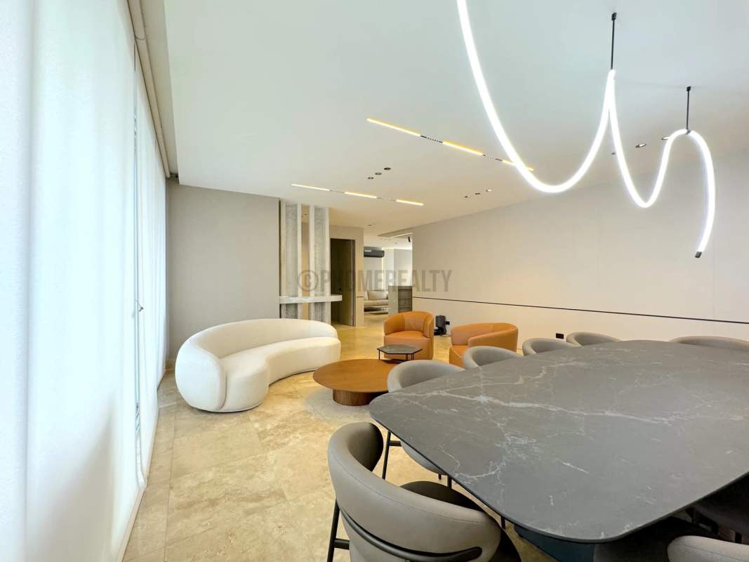 High-end kitchen with marble counters and appliances in luxury JW Marriott Punta Pacifica condo