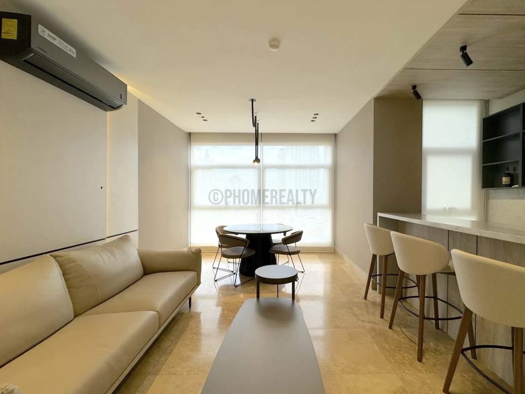 Elegant bedroom with panoramic ocean view floor-to-ceiling windows in luxury condo Punta Pacifica