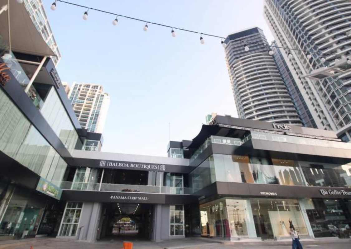 Modern multi-level shopping and commercial plaza exterior with glass facade in Bella Vista Panama City