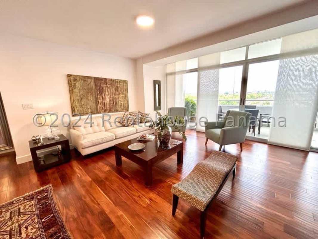 Dining area with hardwood floors and large windows in PH Costa del Este Panama
