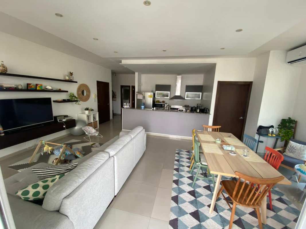 Modern open living and kitchen area with city views PH Quadrat Panama City