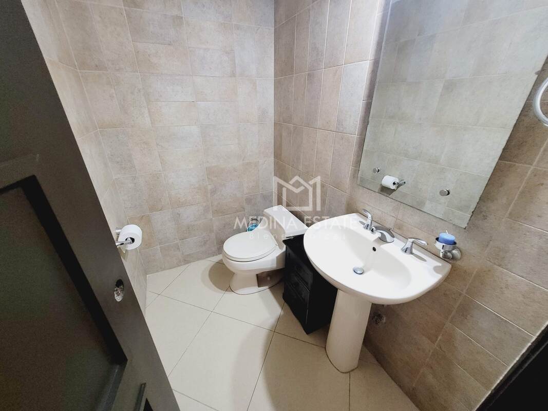 Modern bathroom with bathtub, double vanity and separate shower Embassy Club Clayton