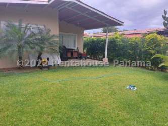 Living and dining area with windows, AC, tiled floors Coronado Panama beach house for sale