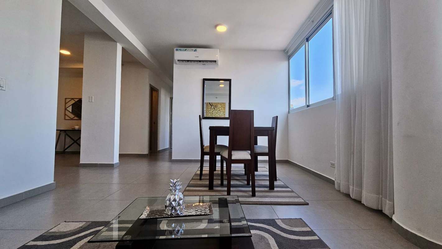 Open plan dining and living room with panoramic views at PH Signature Point Panama