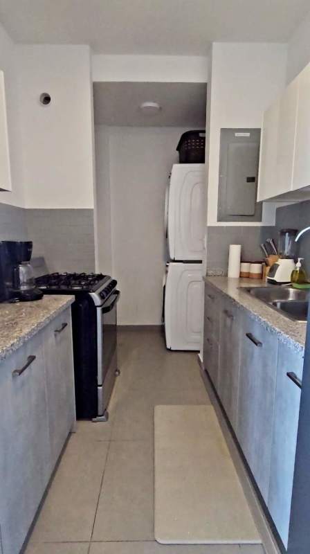 Spacious furnished bedroom with skyline view in PH Signature Point Panama City