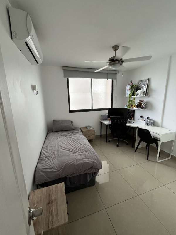 Bedroom with workspace, ceiling fan, AC and natural light in PH San Francisco Bay Panama