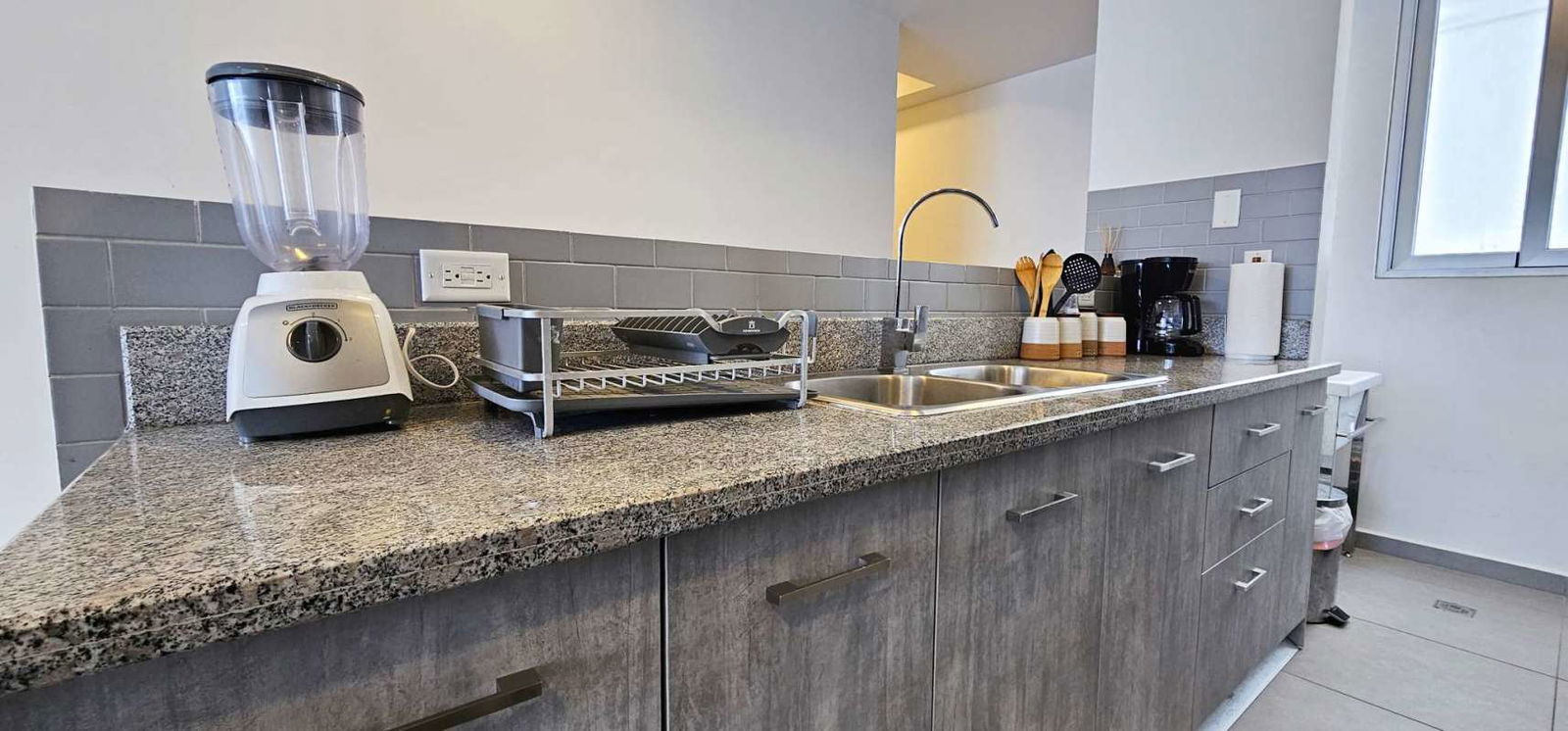 Second bedroom featuring corner windows, air conditioner, city view, modern furniture PH Signature Point