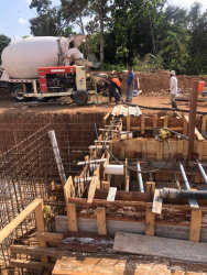 Model home at Las Hermosas subdivision with porch and driveway in La Chorrera Panama