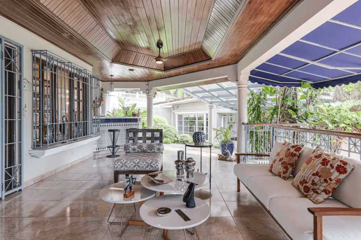 Curved private swimming pool with landscaped tropical garden in luxury house Panama City dos mares