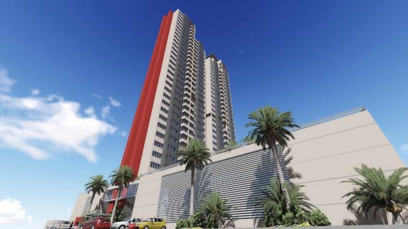 Modern high-rise condominium PH Sky Park Carrasquilla in Panama City with balconies and red accent wall