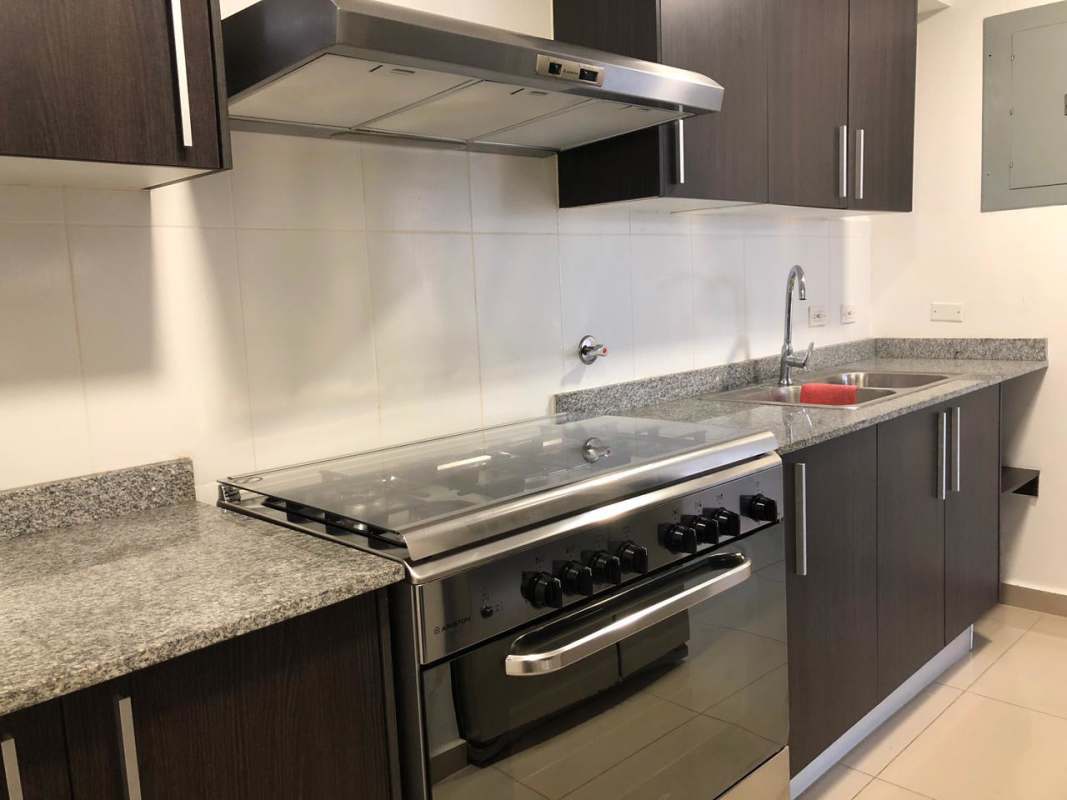 Modern infinity rooftop pool with lounge chairs at PH Sky Park Carrasquilla Panama City