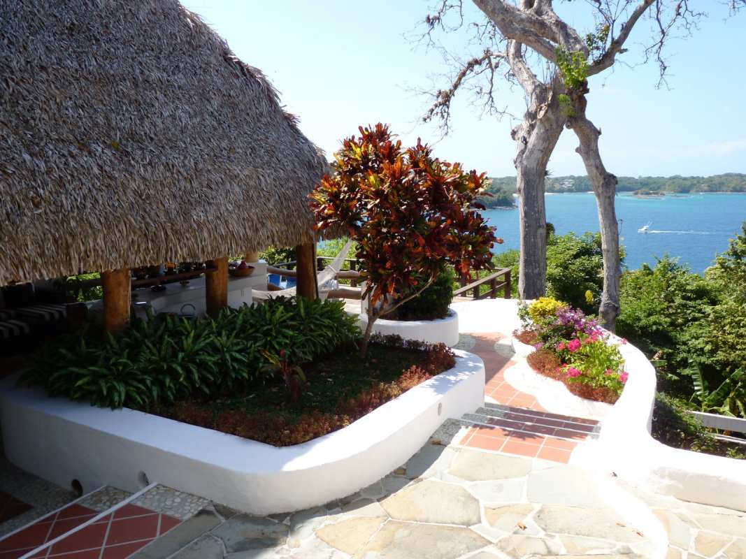 Mediterranean style patio with lush landscaping ocean view Contadora Panama