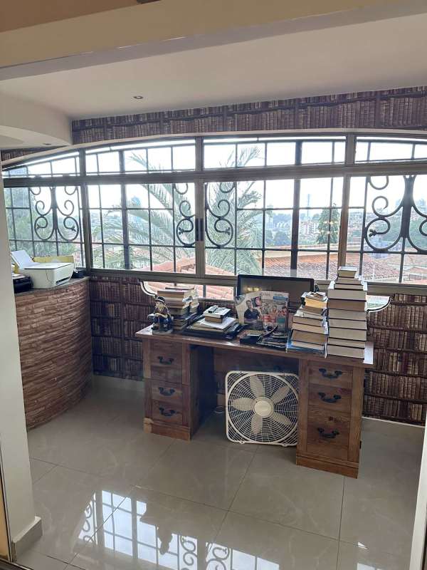Double-height foyer with marble staircase and chandelier Mediterranean corner house Altos de Panama